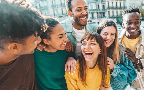 Invisalign patient in Conway smiling with friends