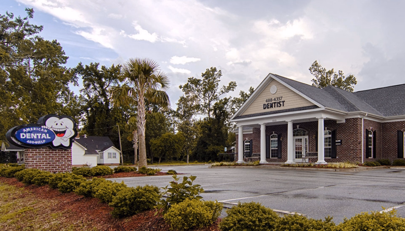 Outside view of American Dental Care office building in Conway