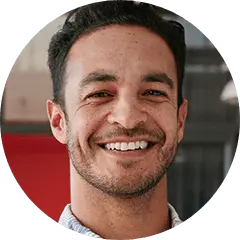 Man with black hair smiling