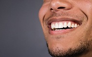 a man smiling with healthy gums